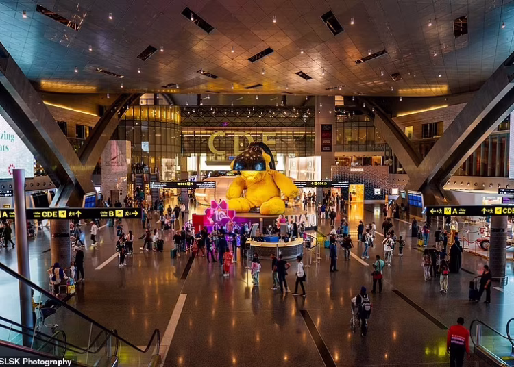 95946349-14443341-The_passenger_terminal_is_the_biggest_building_in_Qatar_and_a_jo-a-4_1741507148751