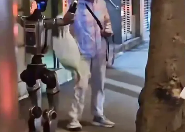 robot-escorted-away-cops-terrorizing-1123483376