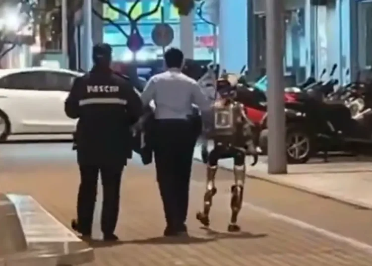 robot-escorted-away-cops-terrorizing-123483355